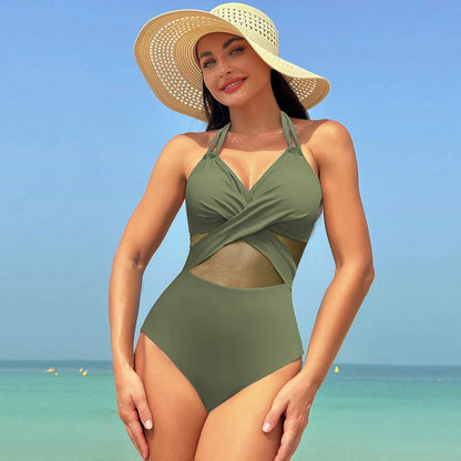 One-piece swimsuit with halter-neck and cross-strap design, available in various solid colors and a leopard print pattern