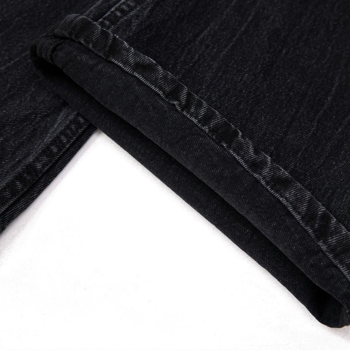 Men's black straight-leg jeans featuring a distinctive lightning crack washed pattern on the denim.