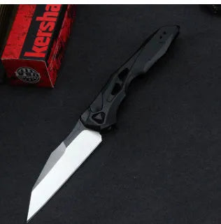 Black folding fruit knife with D2 steel blade and aluminium handle, shown open with length scale.