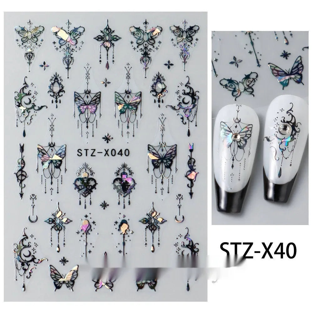 Assortment of black and silver nail sticker designs including cartoon and French tip patterns on a plastic sheet.