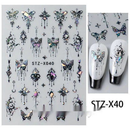 Assortment of black and silver nail sticker designs including cartoon and French tip patterns on a plastic sheet.