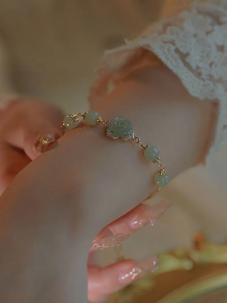 Women's bracelet with Hetian jade rose flower design and 14K gold gilding