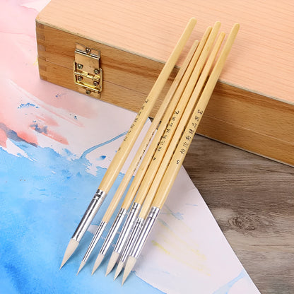 Six wooden-handled pen brushes with pointed wool bristles in conventional colours for artistic line work