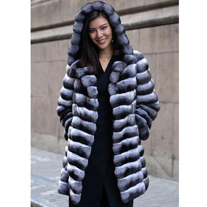 Women's zebra stripe pattern faux fur overcoat with regular sleeves, shown in a medium length.