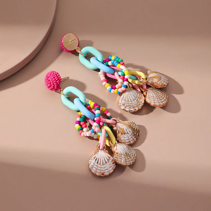 Handmade bohemian shell tassel earrings for women with colourful flower and geometric drop design