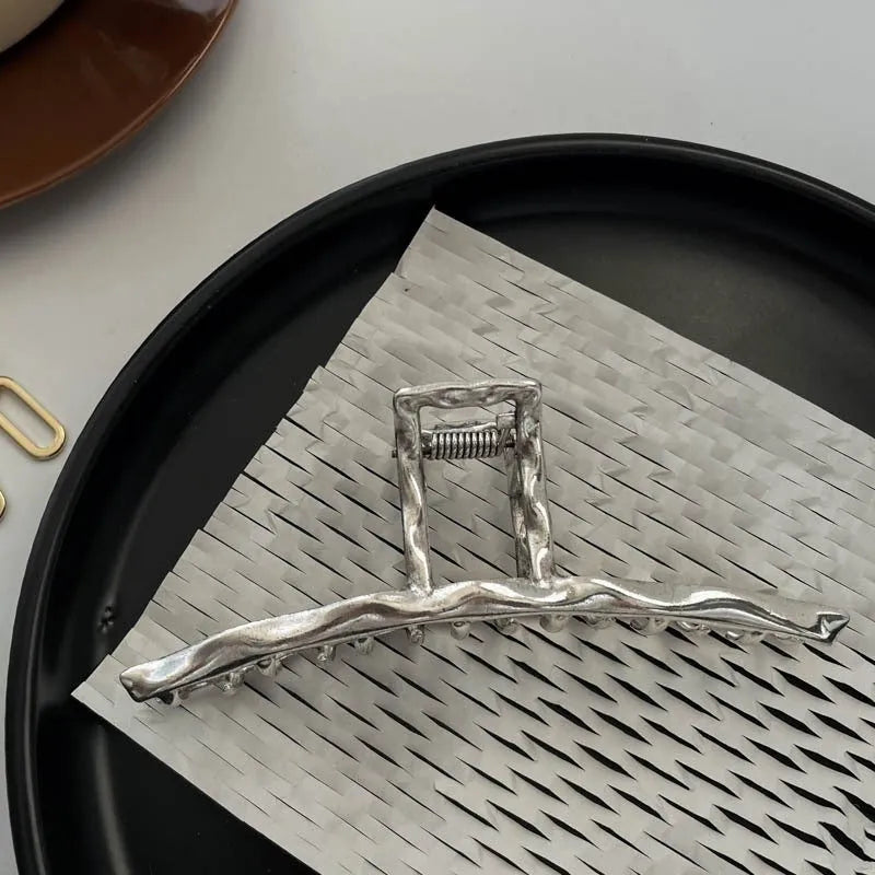 Silver metal hair claw barrette example from a range of 44 Korean-style designs.