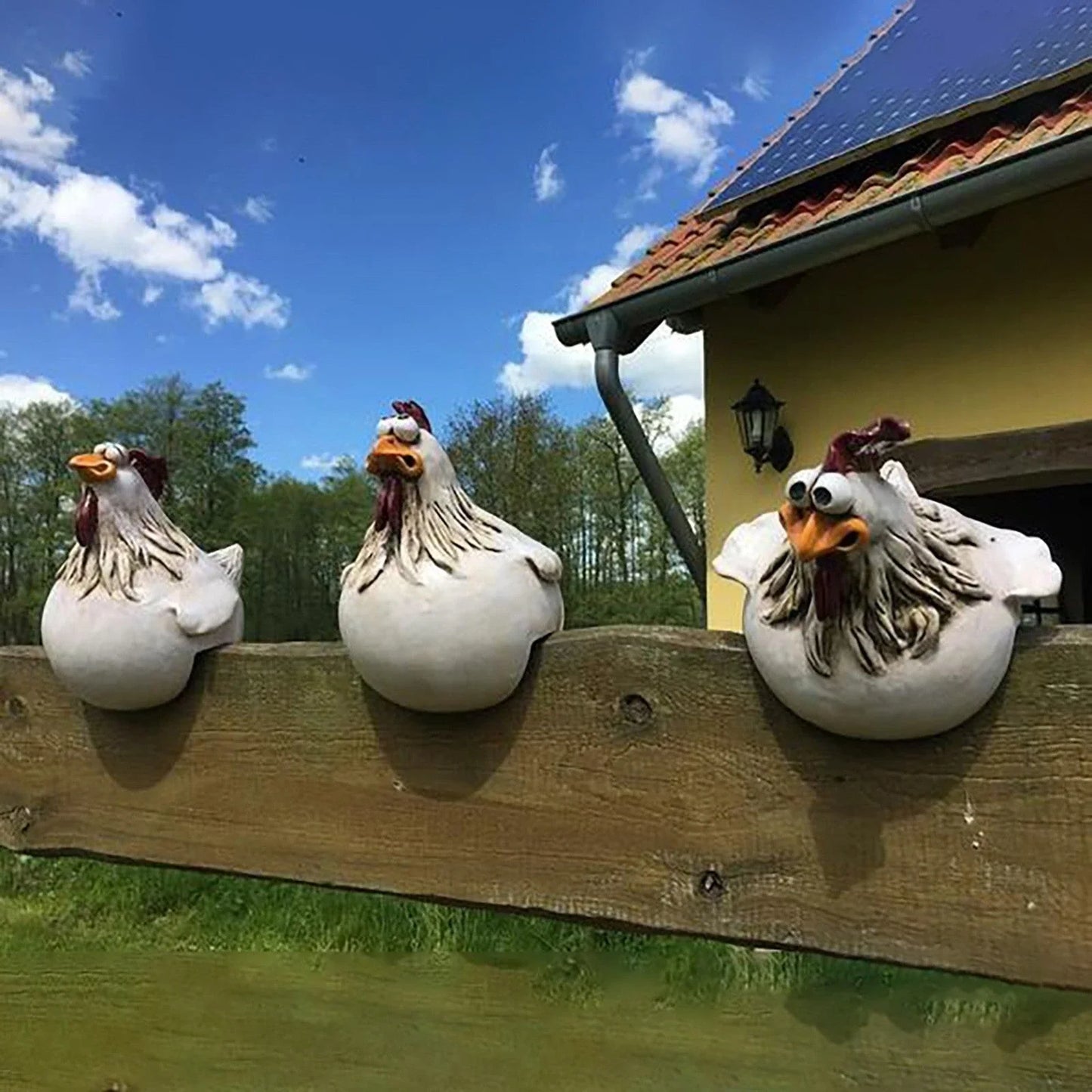 Resin chicken garden ornament with vibrant colours and charming design, adding whimsical appeal to outdoor British garden display