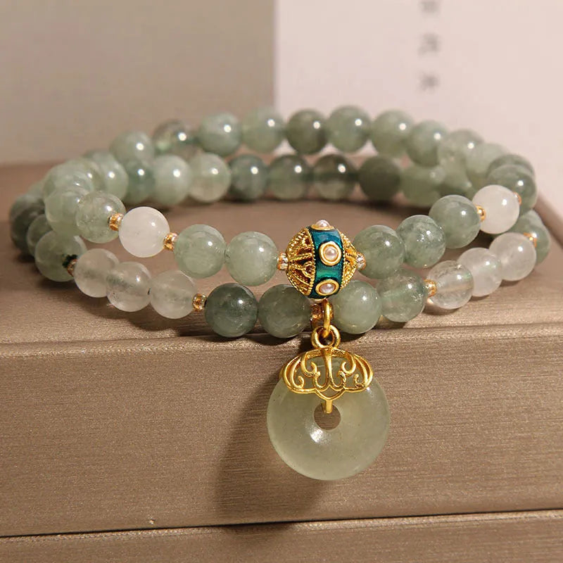 Women's aventurine double-layer jade bracelet with peace buckle closure and rhinestone details