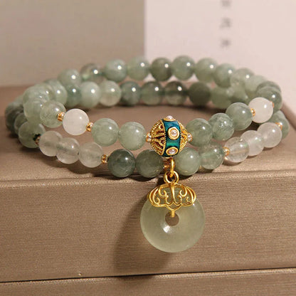 Women's aventurine double-layer jade bracelet with peace buckle closure and rhinestone details