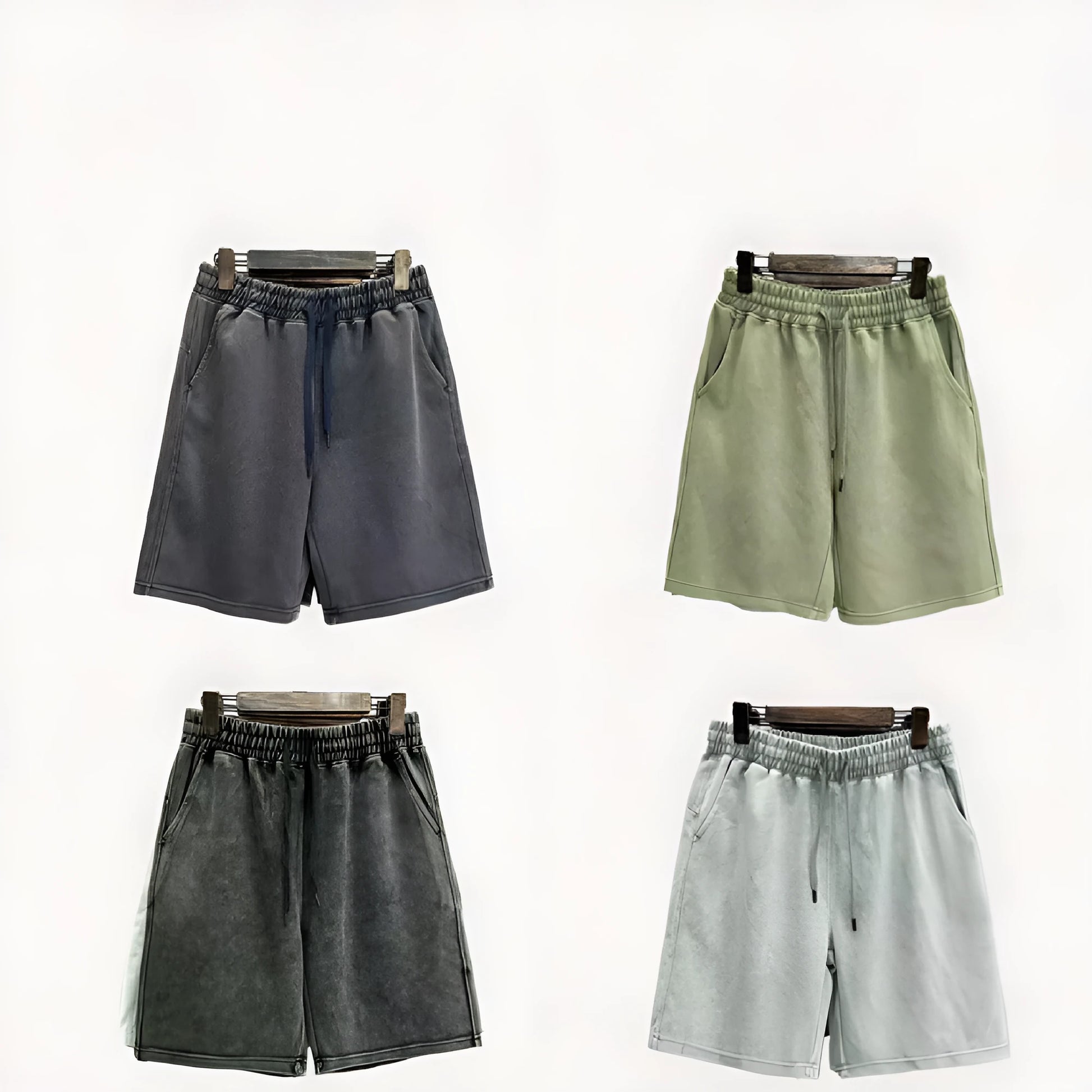 Man wearing loose-fit, straight-leg distressed cotton shorts in a solid colour