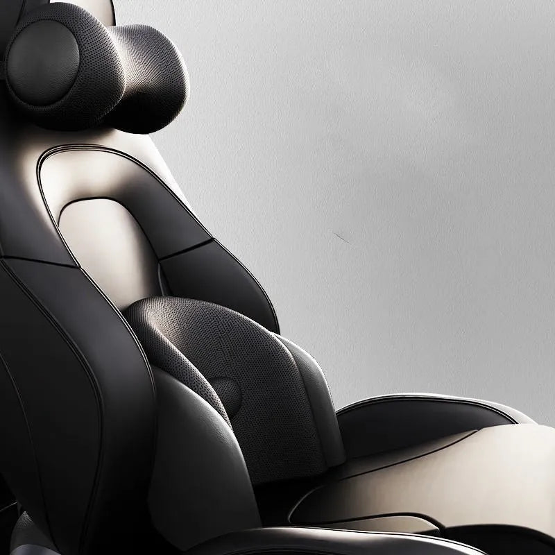 Black car massage cushion with headrest and lumbar support on a car seat, showing wired controller.