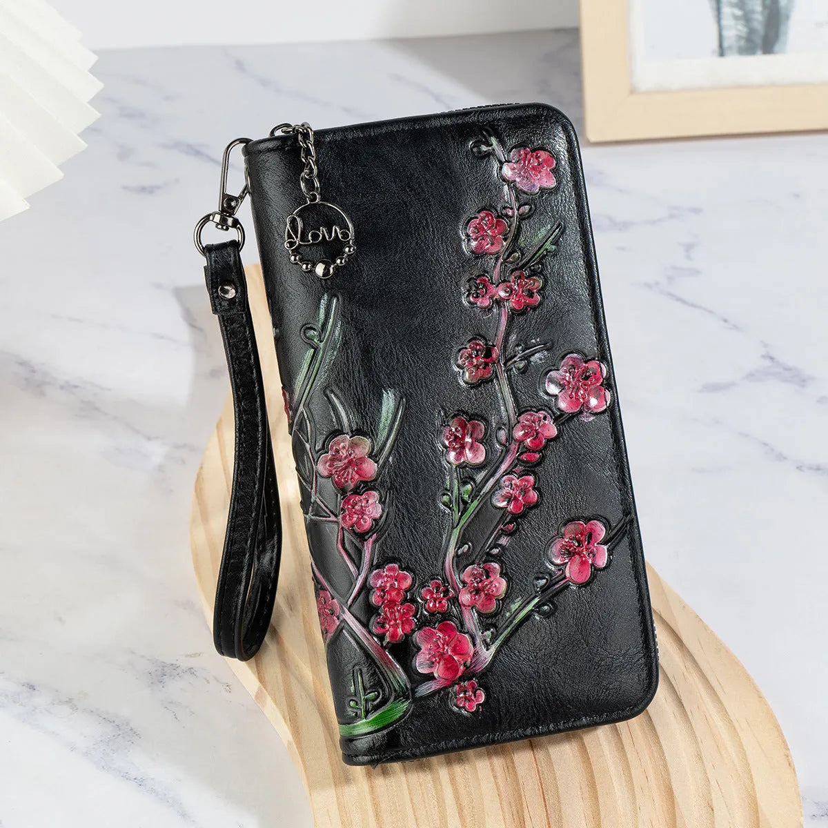 Chinese style embossed floral handbag with zip closure in black or brown colours