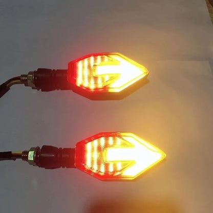 Arrow-shaped LED motorcycle directional turn signal light for 12V systems.