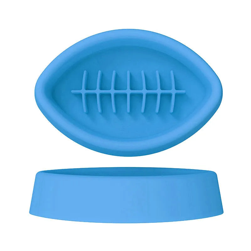 Blue silicone pet slow feeder bowl with textured interior and a white suction cup base on a wooden floor.