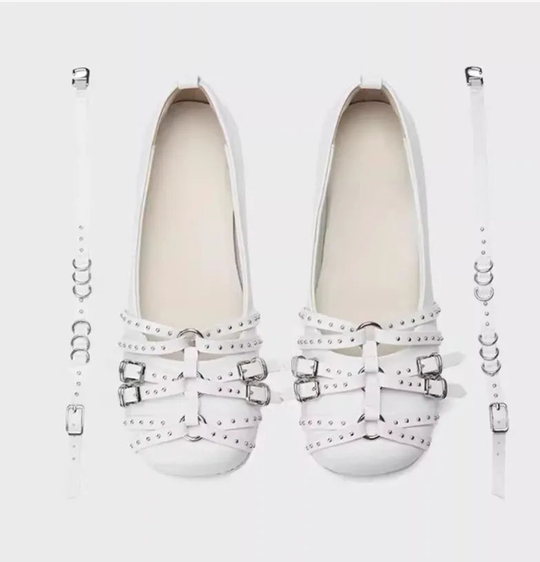 Women's black patent leather retro pumps with square toe and buckle closure on low flat heel