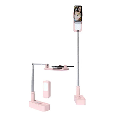 Pink floor-standing fill light with telescopic aluminium alloy stand and wireless remote for mobile phone live streaming.