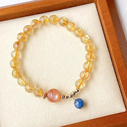 Gold rutilated quartz sunstone crystal bracelet with diamond shape and round elements for women