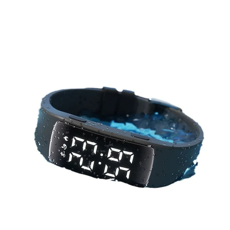 Smart electronic watch with vibration alarm on a silicone strap, showing LED display and 11mm thick case.