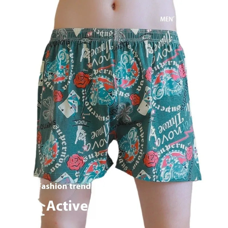 Men's loose fit cotton printed boxer shorts in a grey and blue pattern on a mid waist design.