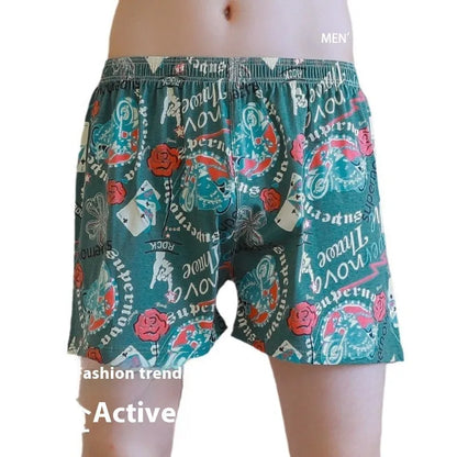Men's loose fit cotton printed boxer shorts in a grey and blue pattern on a mid waist design.