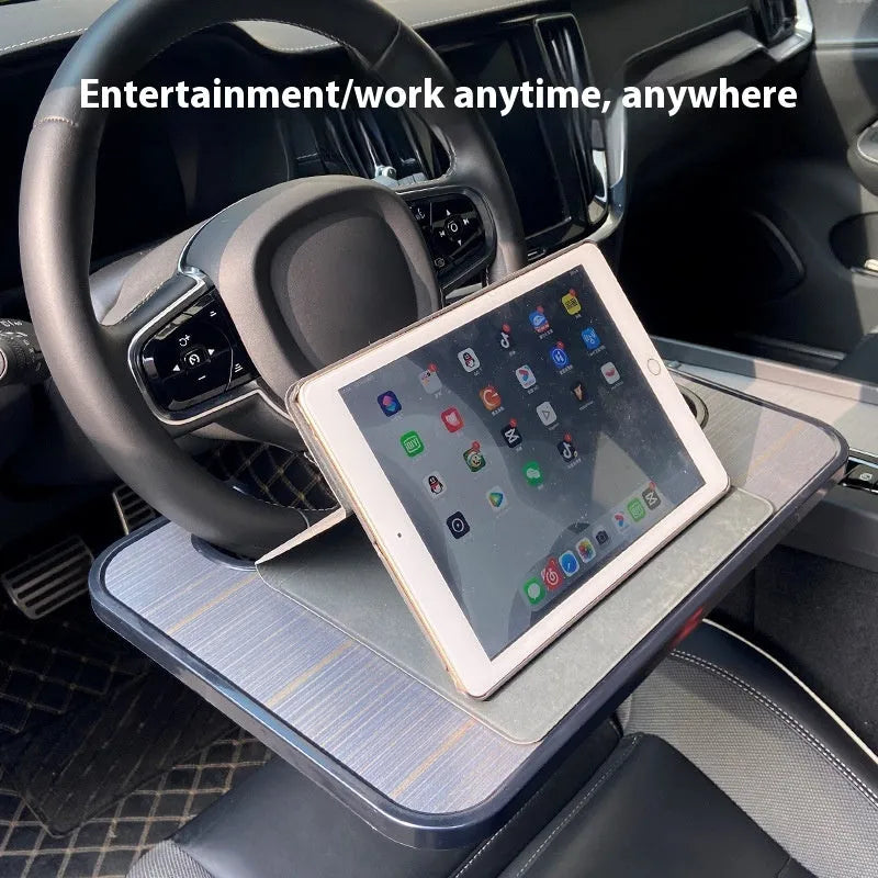 Foldable black car laptop and dining tray with cup holder on a steering wheel