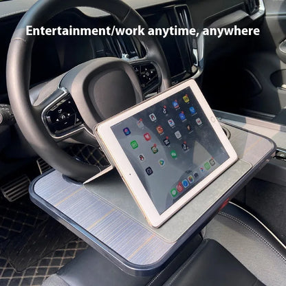 Foldable black car laptop and dining tray with cup holder on a steering wheel
