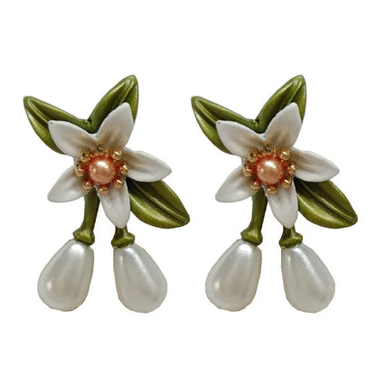 Alloy flower earring set with sterling silver needle detailing showing both stud and clip styles