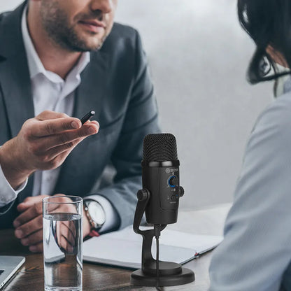 Black Boya BY-PM500 USB microphone with built-in sound card on a desktop.