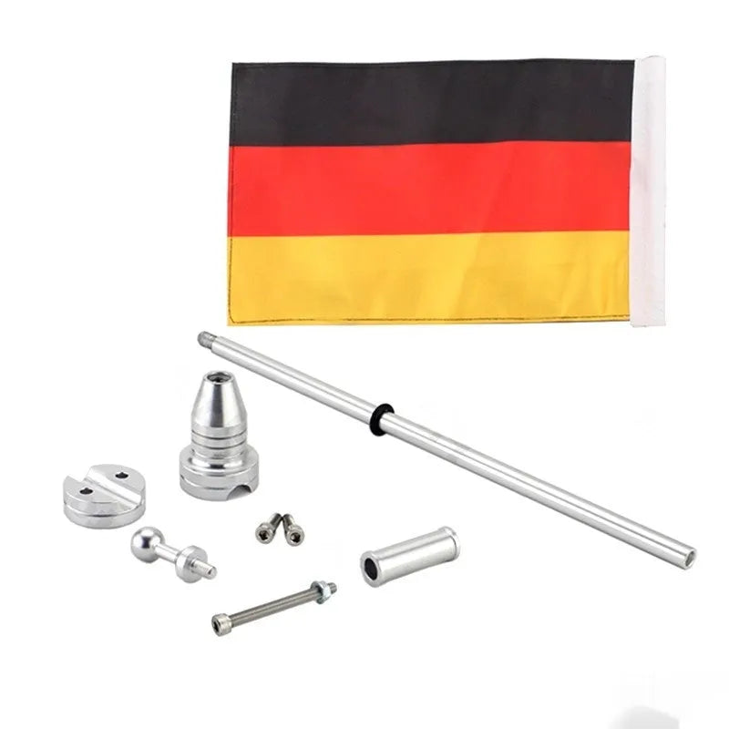 Motorcycle tail box flagpole for mounting on luggage carrier, in black or silver finish.
