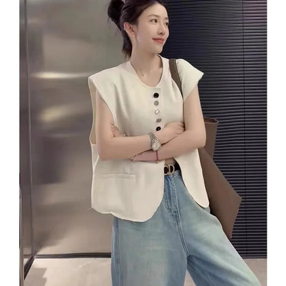 Beige loose-fit women's waistcoat with pockets on a hanger, showing short 40cm length and V-neck design.