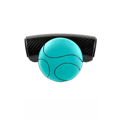 Black steering wheel assist ball with silicone grip mounted on car steering wheel