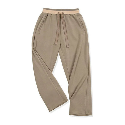 Men's loose straight polyester sweatpants in dark blue, grey or light brown with medium elastic waist and anti-wrinkle finish