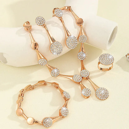 Gold tone alloy jewellery set with flower pendant necklace, bracelet and earrings in plant and flower pattern