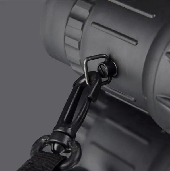 Black 16x52 high-power monocular with roof prism design and green lens coating.