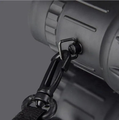 Black 16x52 high-power monocular with roof prism design and green lens coating.