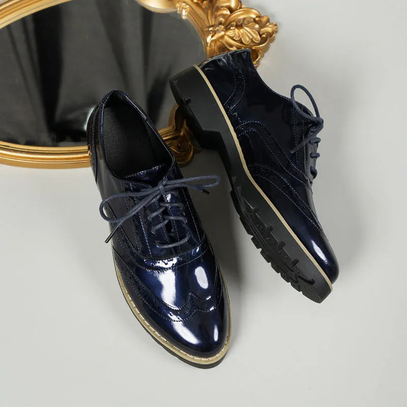 Women's black sequin lace-up loafers with a wedge heel and round toe