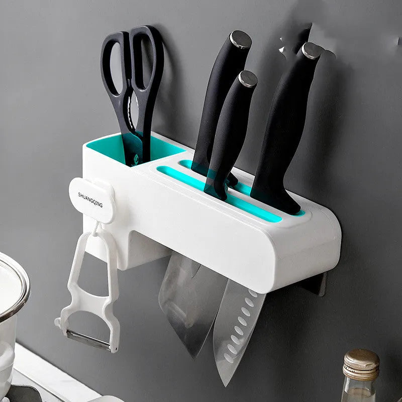 White modern plastic knife block holding six kitchen knives on a countertop.