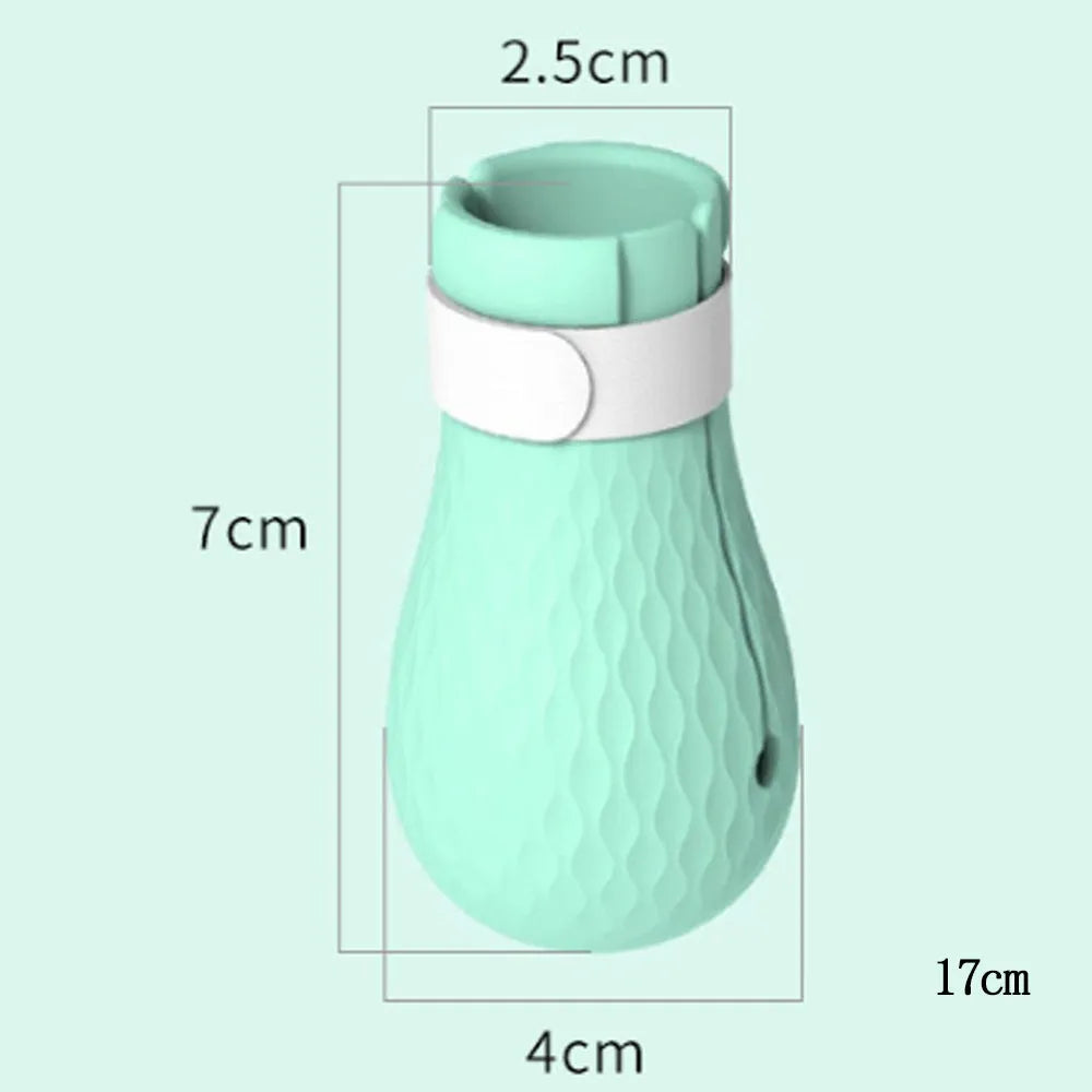 Four green silicone cat paw scratch protector foot covers for pet grooming and handling