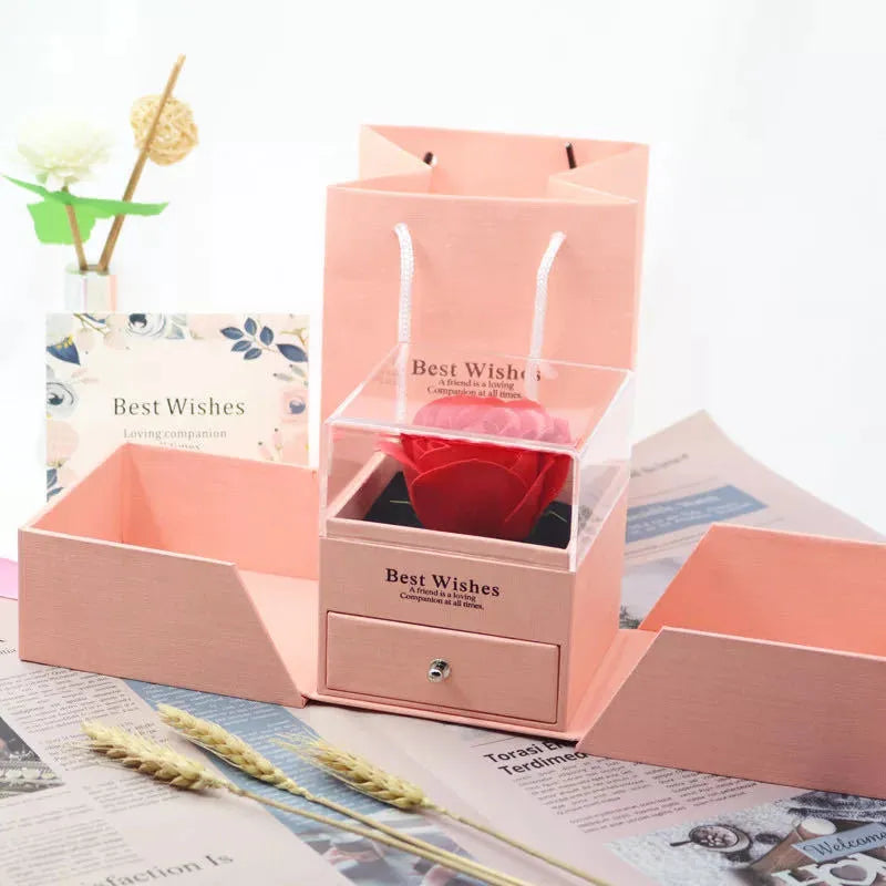 Cardboard jewellery gift box with inner packaging compartments, shown in pink colour.