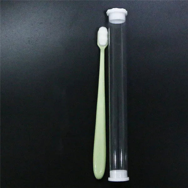 Micron soft toothbrush with coloured handles and different bristle styles including flat head and wavy designs