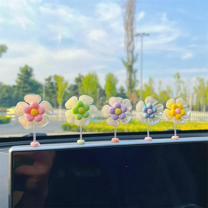 Small plastic car decoration swing measuring 5cm tall in blue, green, pink, purple, and yellow colour options