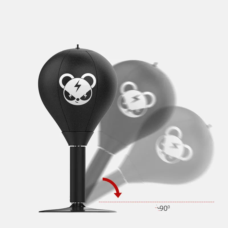 Tabletop boxing speed ball with suction cup base on a desk, showing burst bear design and flexible connection tube