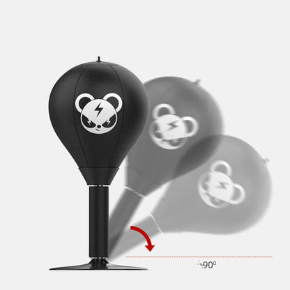 Tabletop boxing speed ball with suction cup base on a desk, showing burst bear design and flexible connection tube