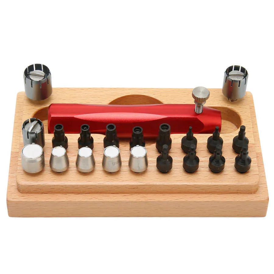 20-piece steel watch case opening tool set laid out on a surface