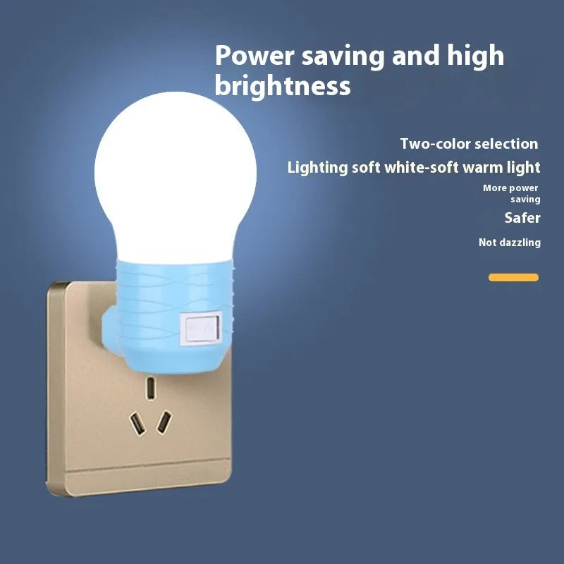 Plug-in bedside baby night light in white, blue, or pink shell with round shape.