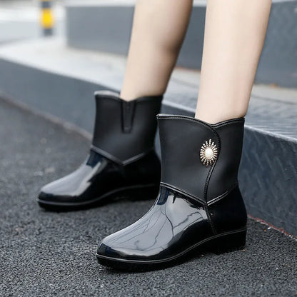 Women's mid-calf rain boots in beige, black, or purple with a non-slip sole.