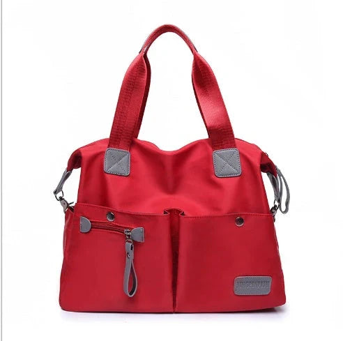 A fashionable and versatile ladies tote bag with multiple compartments and carrying options for the modern woman on the move.