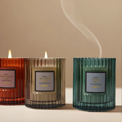 Soy wax aromatherapy candle in cylindrical shape showing red, green and amber colour options