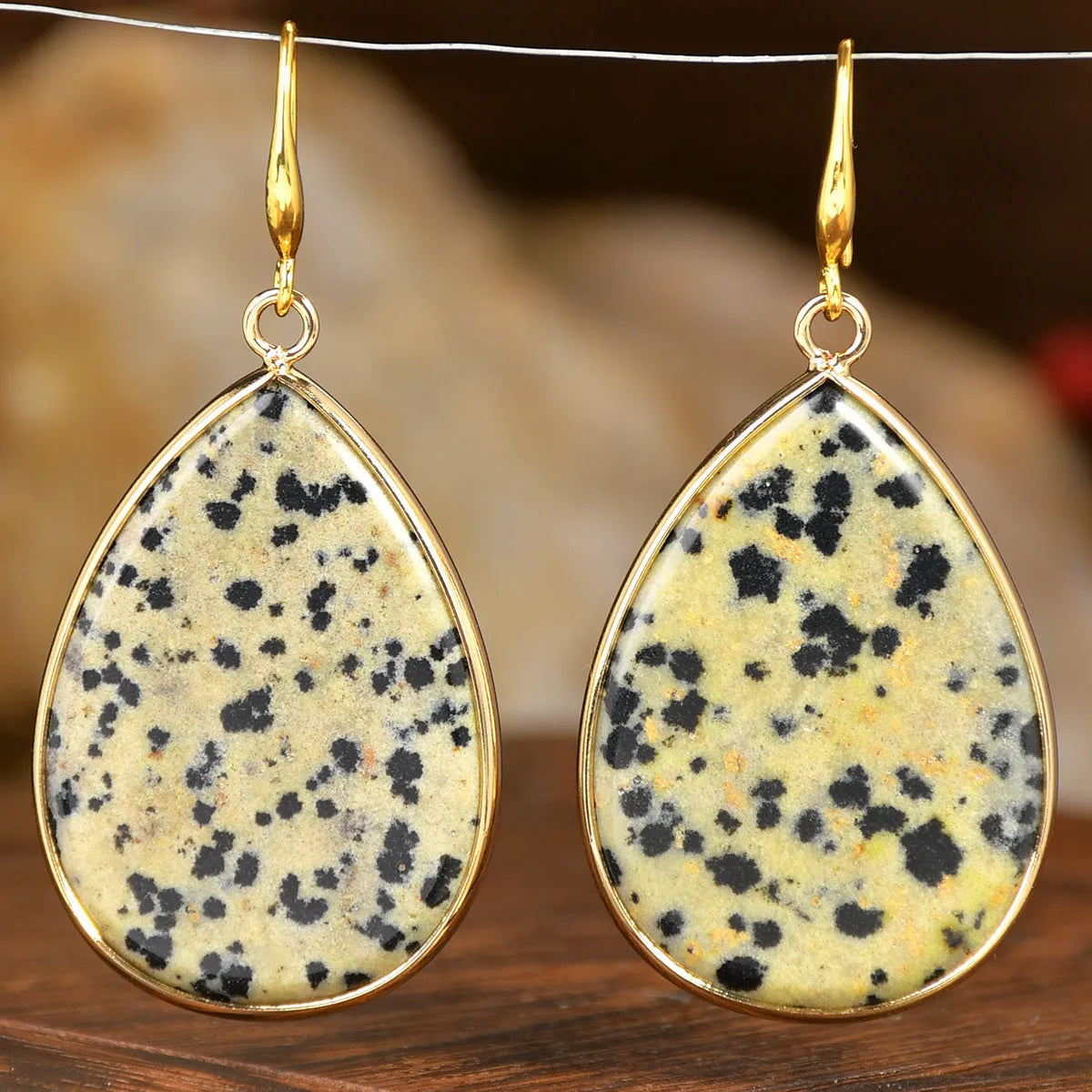 Women's retro-style drop earrings with a natural stone pendant in a water drop shape on an electroplated setting.