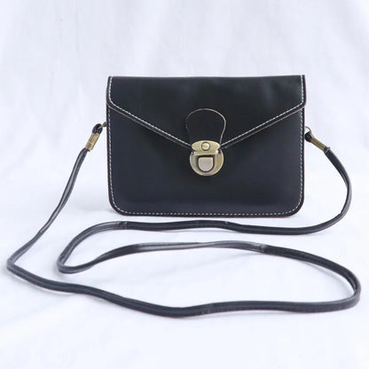 Retro shoulder messenger bag in cross square shape with flap and lock closure, showing internal mobile phone compartment